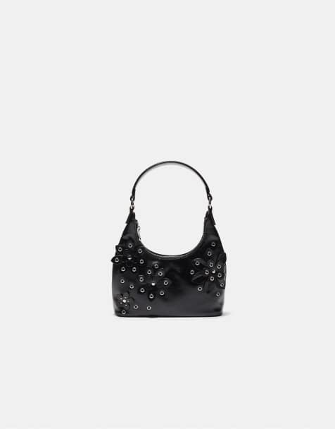 Stradivarius Shoulder bag with eyelets and floral details in black - view 1
