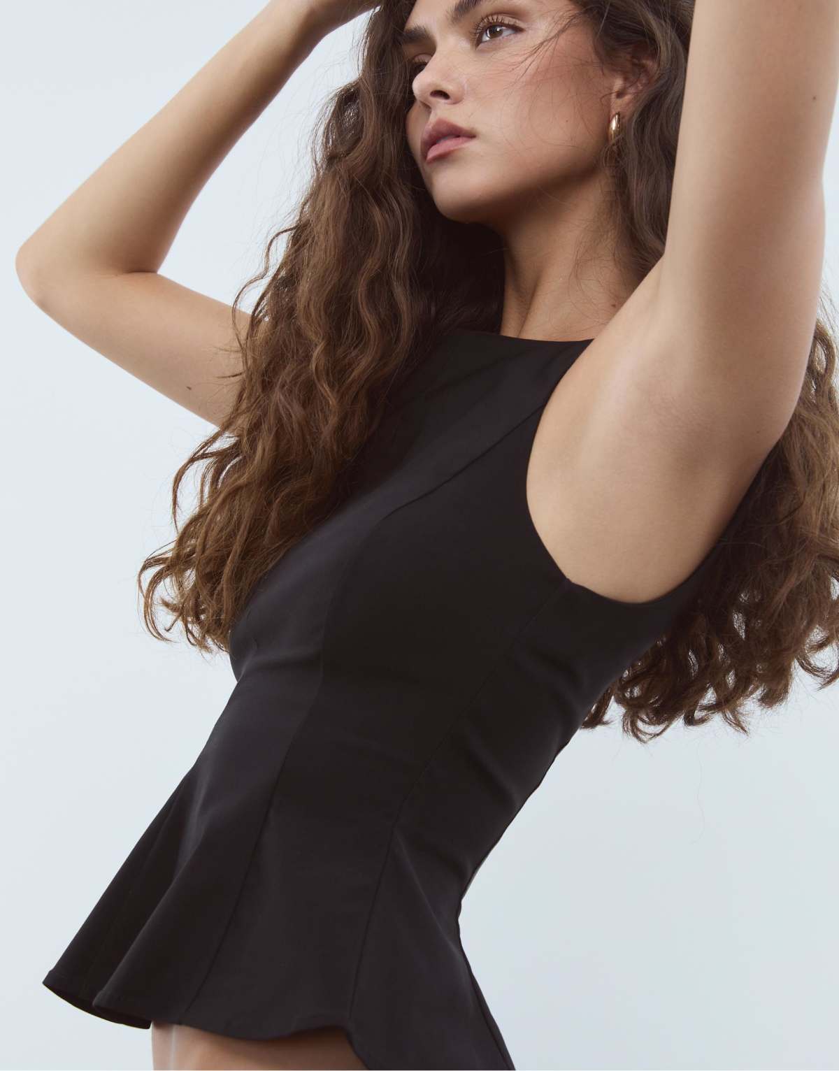 Stradivarius Sleeveless peplum top in black