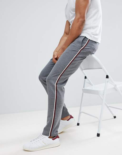 Grey trousers with store white side stripe