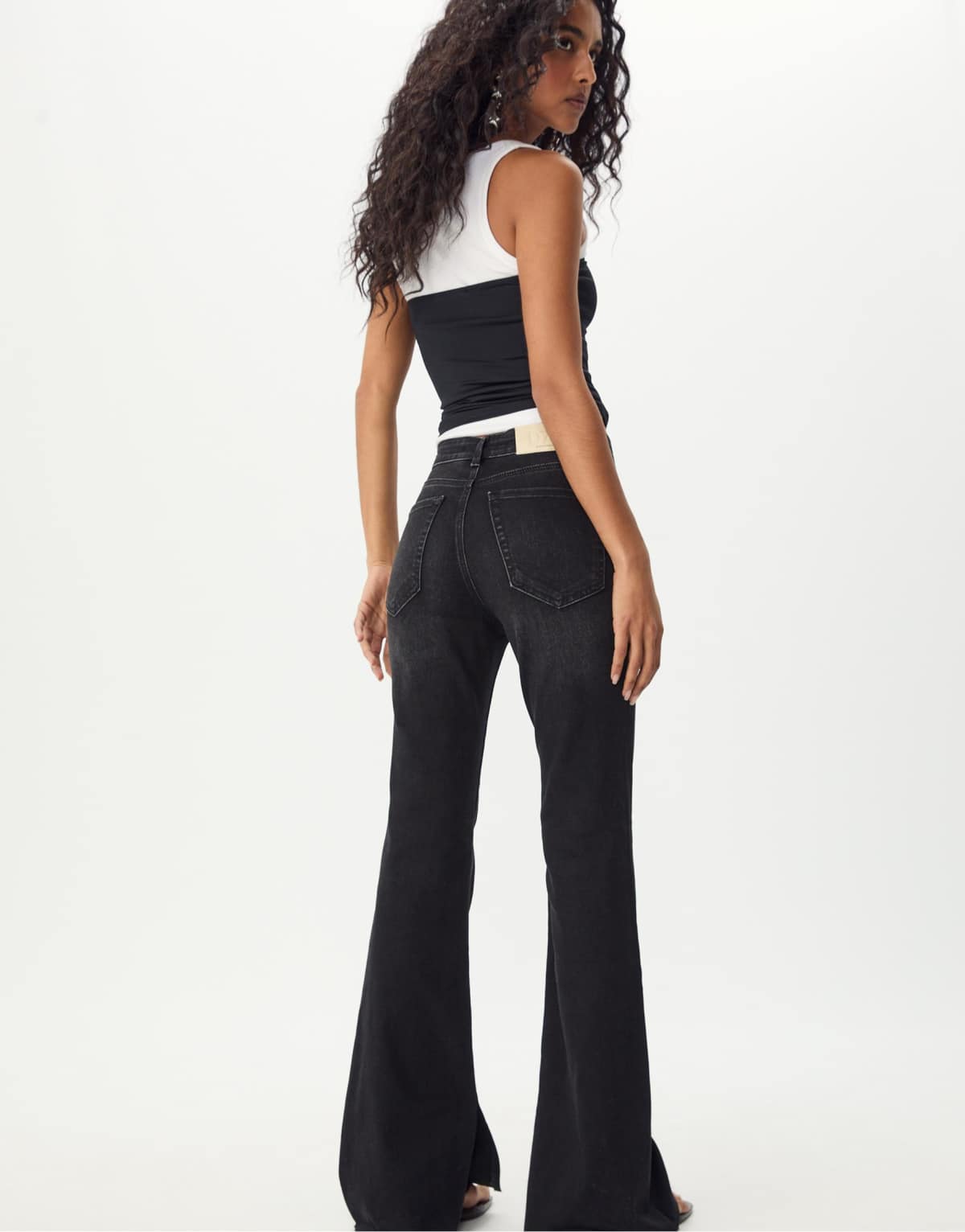Stradivarius Slit fit flared jeans in black denim rinse wash