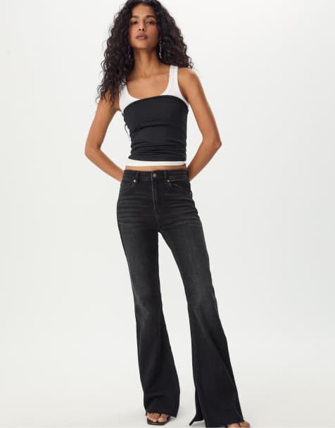 Stradivarius Slit fit flared jeans in black denim rinse wash