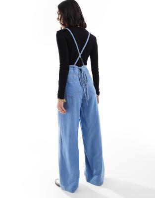Stradivarius soft touch denim jumpsuit with cross back in