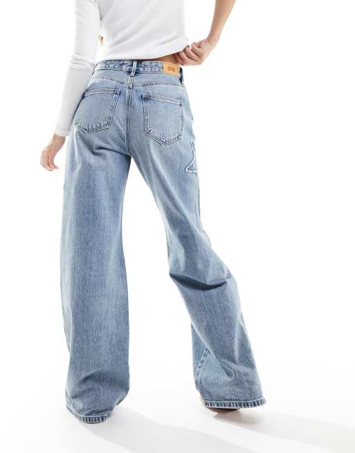 Stradivarius STR Jean ample avec ecusson etoile Bleu moyen