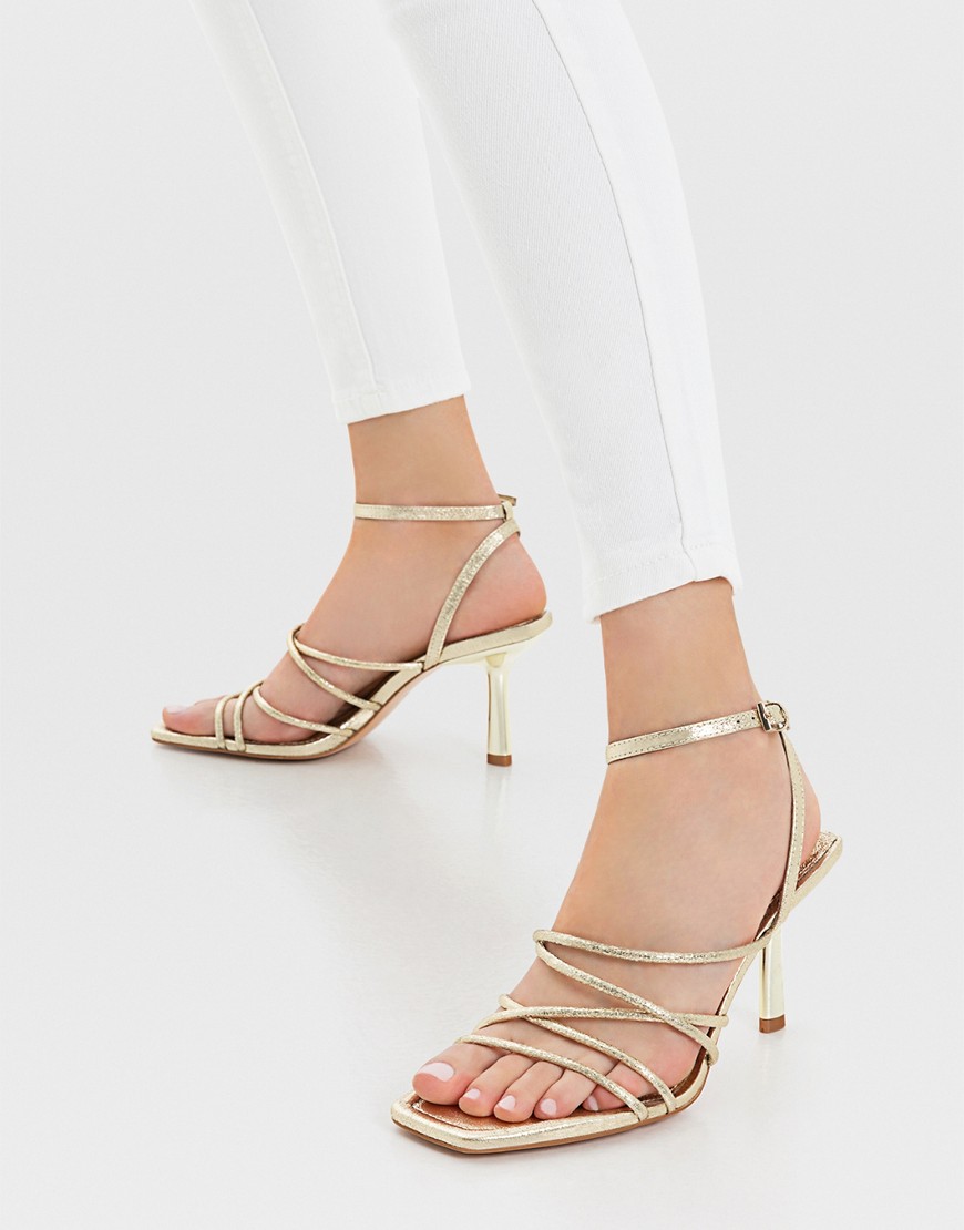 Stradivarius strappy heeled sandal with squared toe in gold