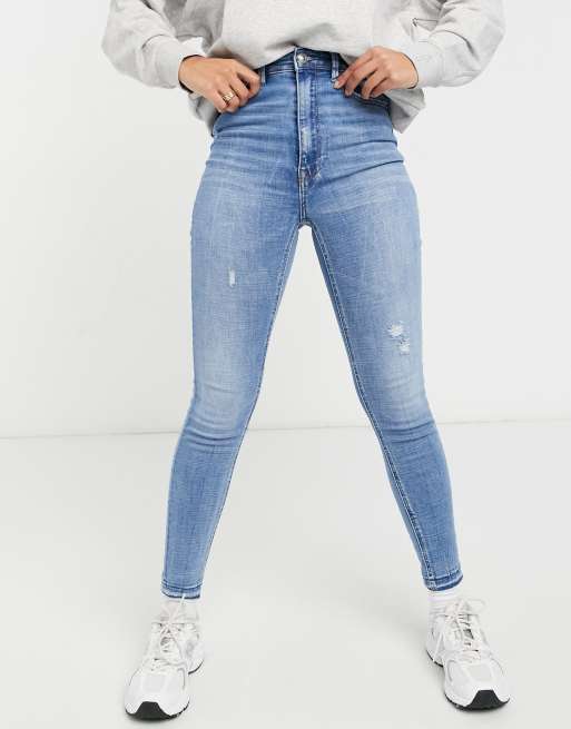 stradivarius stretch flare jean with split detail in light blue