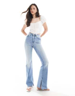 Stradivarius Stradivarius Tall D74 flare slit jean in medium wash-Blue