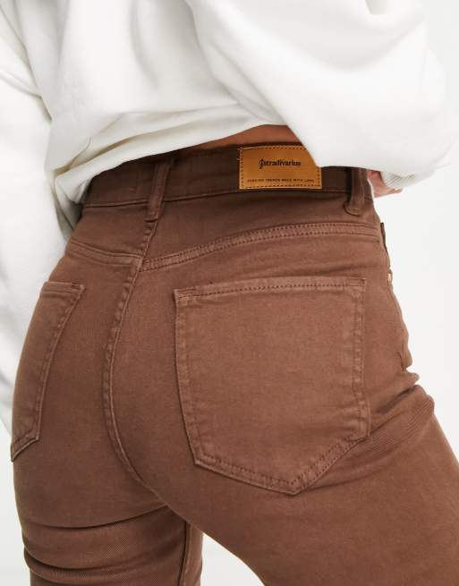 Stradivarius slim flare jean with split detail in brown