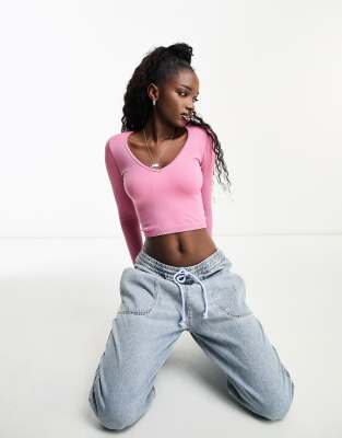 Stradivarius v neck seamless ribbed top in pink 