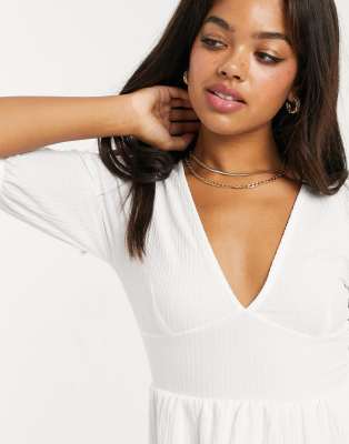 white plunge neck top
