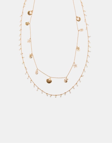 Stradivarius – Vielseitig tragbare Halskette in Gold-Optik mit kleinen Meeresanhängern - view 1