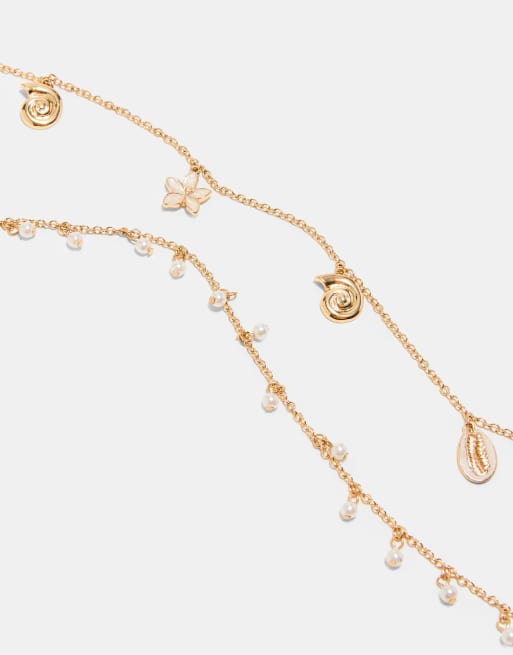 Stradivarius – Vielseitig tragbare Halskette in Gold-Optik mit kleinen Meeresanhängern, 3 von 4
