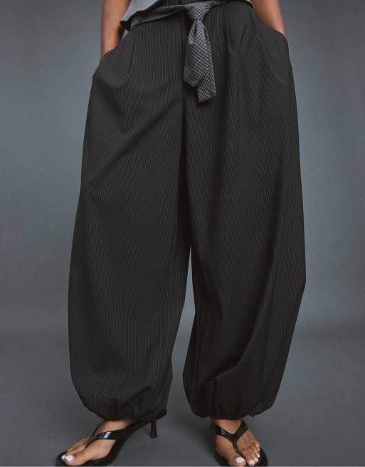 Stradivarius Voluminous tie-detail sarouel trousers in black, 2 of 7