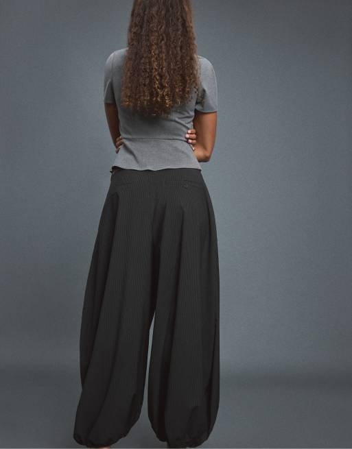 Stradivarius Voluminous tie-detail sarouel trousers in black, 3 of 7