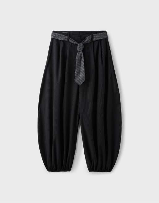 Stradivarius Voluminous tie-detail sarouel trousers in black, 7 of 7