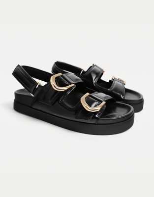 Stradivarius Wide Fit - Flache Slider-Sandalen in Schwarz mit Schnallen