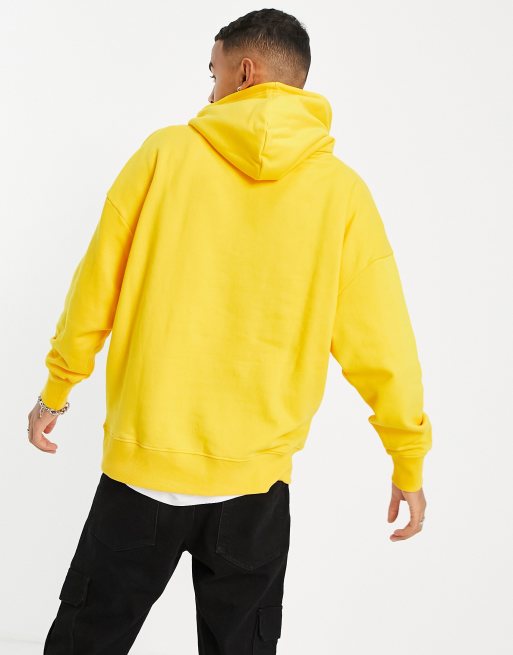 Sudadera extragrande con capucha en amarillo claro de ASOS DESIGN