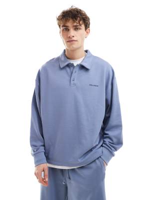 Sudadera azul con cuello tipo polo de COLLUSION (parte de un conjunto)