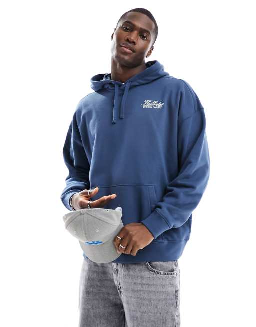 Sudadera azul extragrande con capucha y estampado en la espalda de