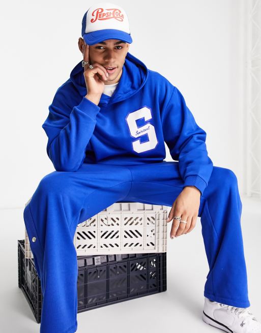 Sudadera azul extragrande con capucha y estampado universitario en el pecho de ASOS DESIGN (parte de un conjunto)