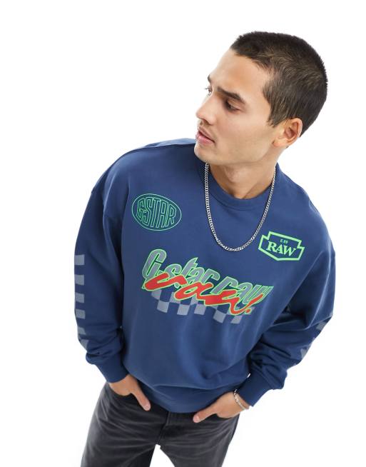 Sudadera azul extragrande con estampados posicionales multicolores
