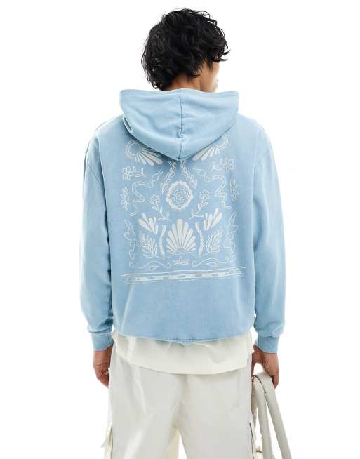 Sudadera azul lavado unisex extragrande con capucha y estampado floral en la espalda de ASOS DESIGN