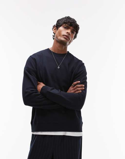 Sudadera azul marino con cuello redondo y diseño minimalista de punto liso de ARKET