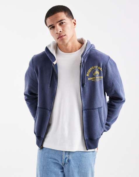 Sudadera azul marino de corte cuadrado con capucha, cremallera y detalle de motivo universitario de Hollister - view 1