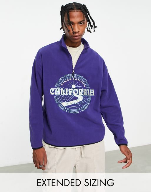 Sudadera azul marino extragrande con cremallera corta y diseño bordado de ciudad de felpa polar de ASOS DESIGN