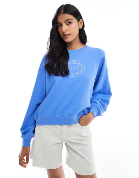 Sudadera azul ultramarino con cuello redondo y gráfico de tejido rizado de Hollister - view 1
