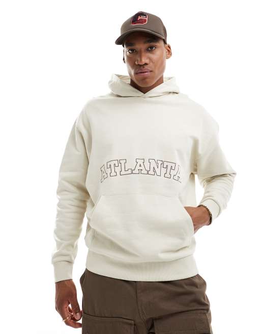 Sudadera beis extragrande con capucha y detalle bordado de nombre de ciudad en la parte delantera de ASOS DESIGN