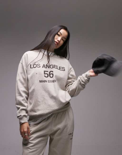 Sudadera beis extragrande con lavado vintage y estampado gráfico 