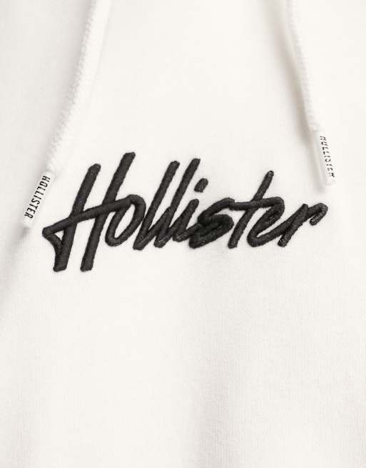 Sudadera blanca con capucha y logo de texto en la parte central de Hollister, 3 de 4