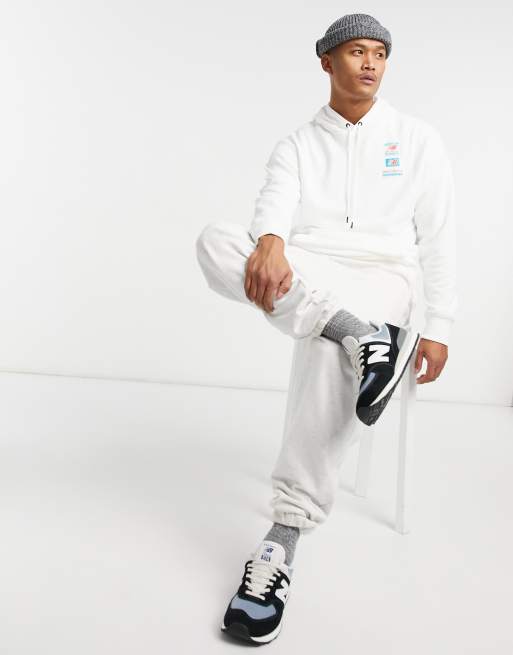 Emigrar para Otoño Sudadera blanca con capucha y logo en la espalda de New Balance | ASOS