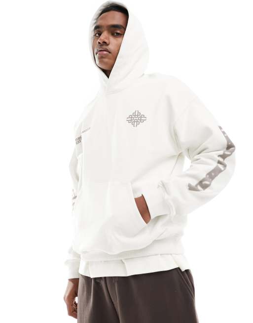 Sudadera blanco hueso con capucha y estampado gráfico de emblema difuminado de The Couture Club
