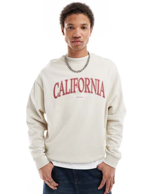 Sudadera blanco hueso extragrande con estampado de ciudad de ASOS DESIGN