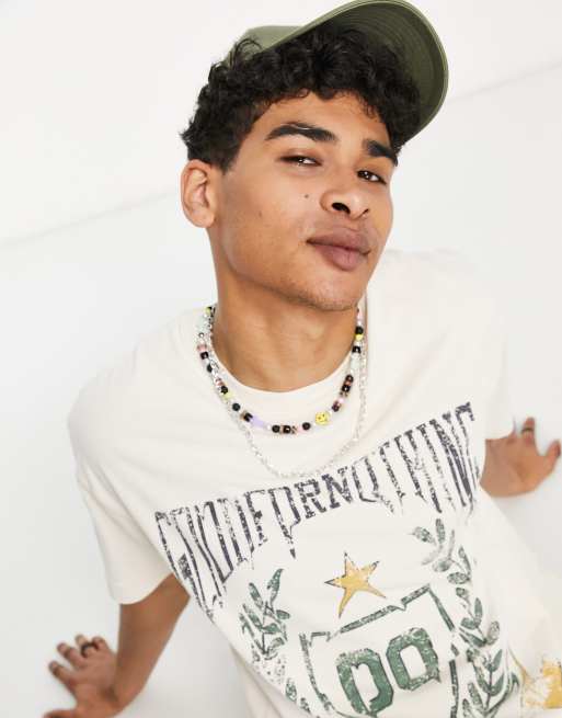 Sudadera blanco hueso extragrande con estampado del escudo efecto fundido de Good For Nothing