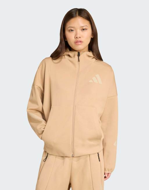 Sudadera color arena cálido con capucha y cremallera Adidas Z.N.E. de adidas Performance