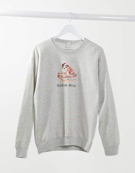 Sudadera color crema con diseño navideño de Skinnydip
