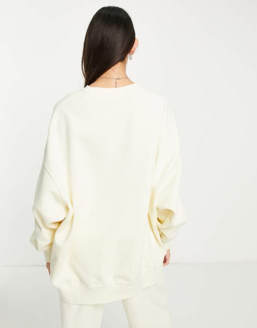 Sudadera color leche de coco básica con cuello redondo y diseño retro de felpa de Nike, 2 de 4
