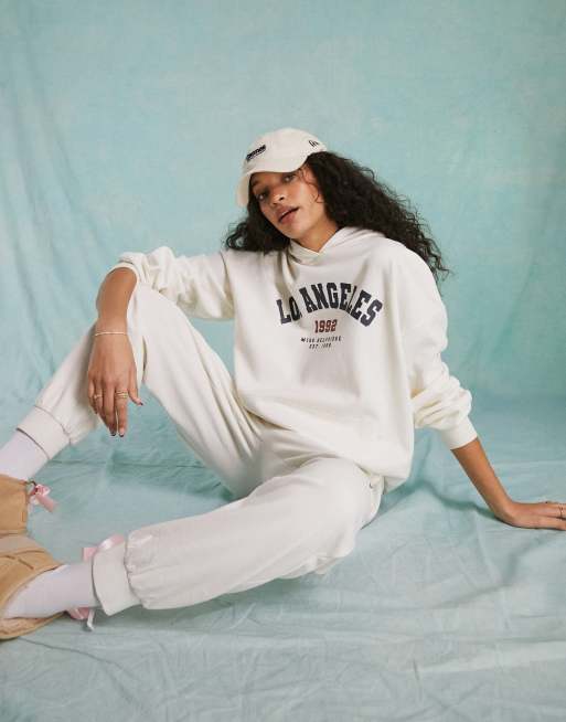 Sudadera color marfil extragrande con capucha y estampado gráfico 