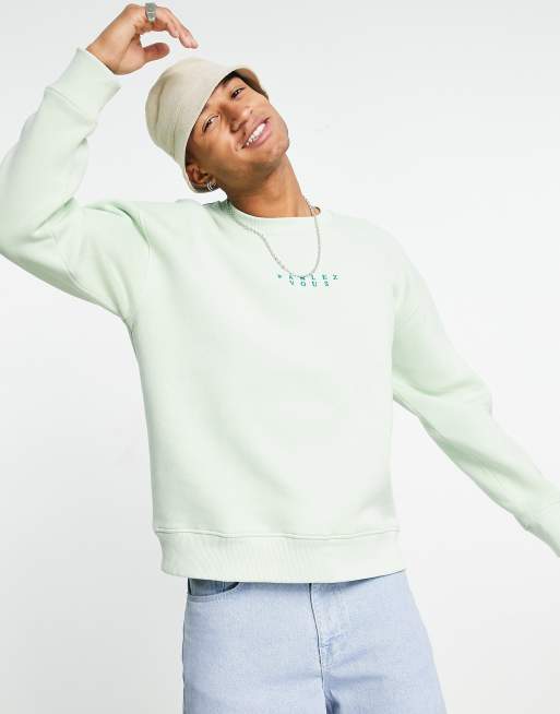 Sudadera color salvia extragrande con bordado de texto 