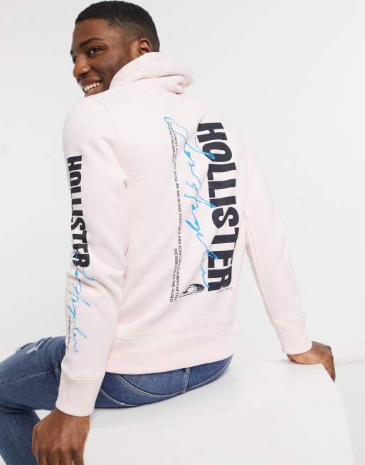 Sudadera con capucha rosa con que brilla la oscuridad en la parte posterior y en la manga de Hollister | ASOS