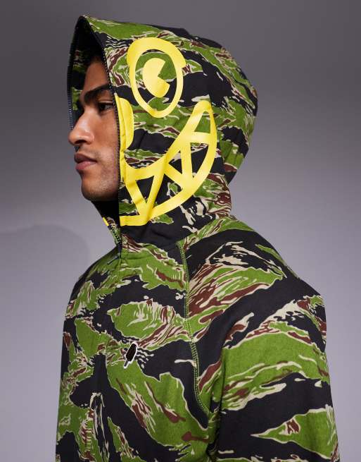 Sudadera con cremallera, estampado de camuflaje a rayas y gráfico de tigre sonriente de ICECREAM, 4 de 5