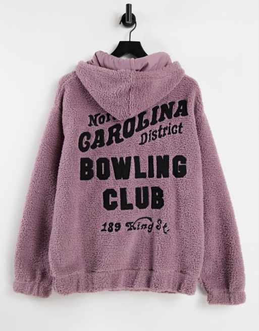 Sudadera extragande con capucha y aplicación de bolos estampada en la espalda de borreguito de ASOS DESIGN