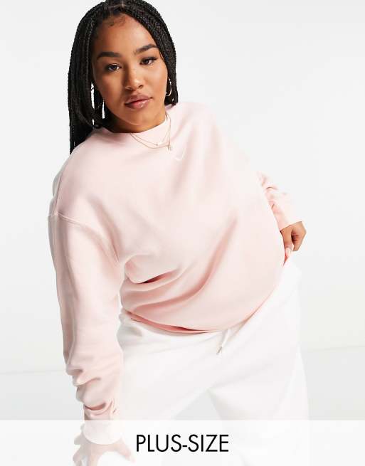 Sudadera extragrande color coral pálido con logo pequeño de Nike Plus