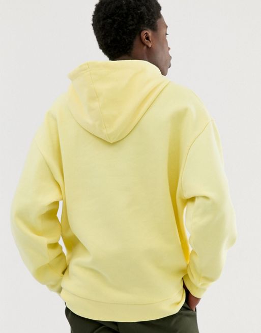 Sudadera extragrande con capucha en amarillo claro de ASOS DESIGN