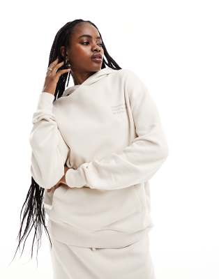 Sudadera extragrande con lavado color crudo, capucha y detalle de la marca de COLLUSION