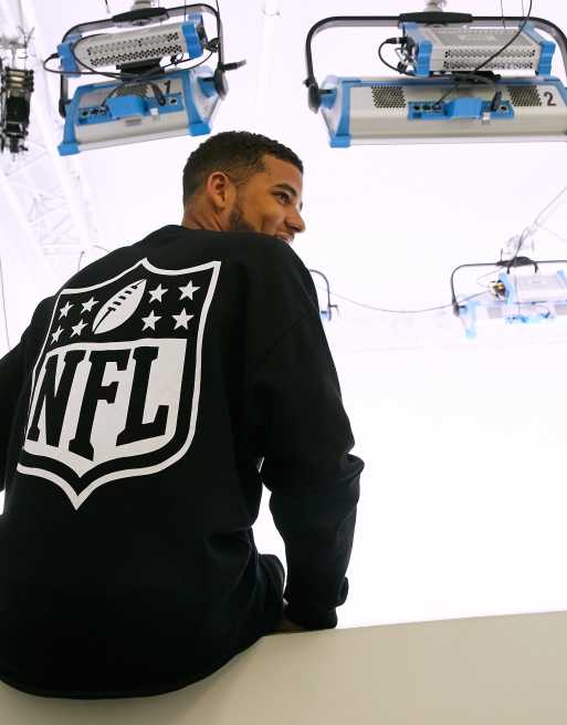 Sudadera extragrande en negro con estampado en la parte posterior NFL de ASOS DESIGN