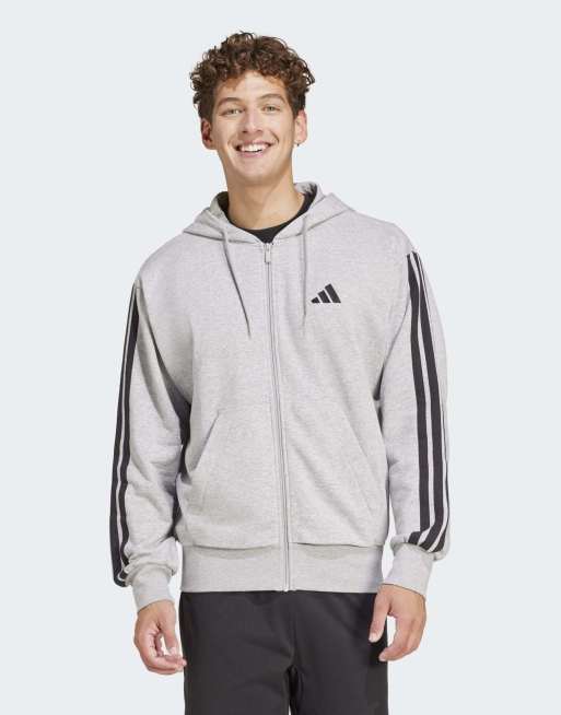 Sudadera gris claro jaspeado y negra con capucha, cremallera y detalle de 3 rayas de felpa de rizo Essentials de adidas Performance