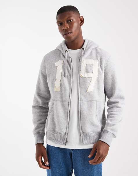 Sudadera gris de corte cuadrado con capucha, cremallera y detalle de motivo de Hollister - view 1